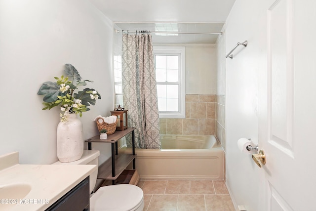 full bathroom featuring tile patterned flooring, vanity, toilet, and shower / bath combo with shower curtain