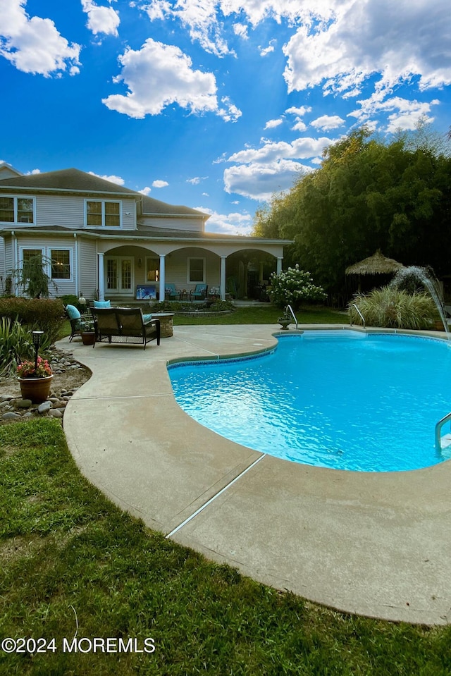 view of swimming pool featuring a patio area