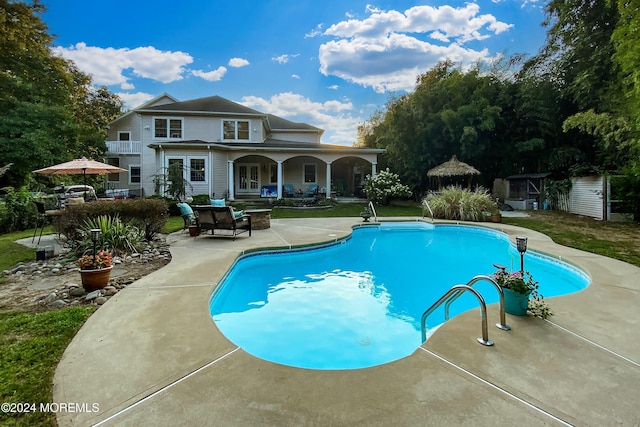 view of swimming pool featuring a patio area