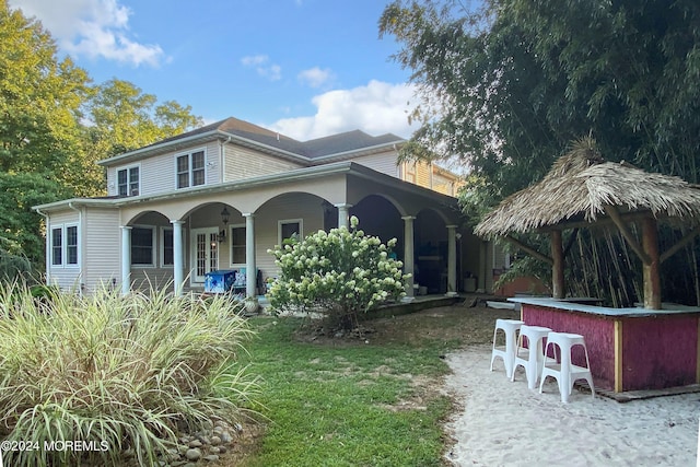 view of front of home featuring exterior bar