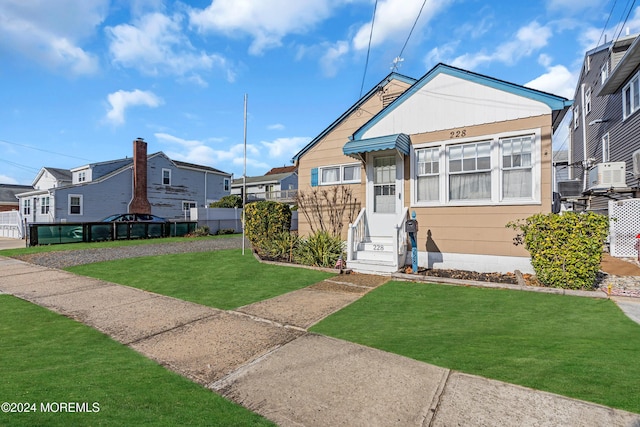 228 Hancock Ave, Seaside Heights, NJ 08751 - view of front of property featuring entry steps, a front yard, and a residential view