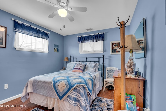 bedroom featuring wood-type flooring and ceiling fan