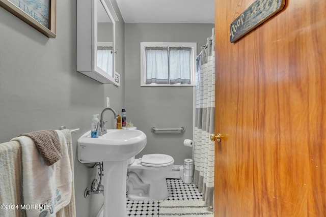 228 Hancock Ave, Seaside Heights, NJ 08751 - bathroom with toilet, a shower with shower curtain, and tile patterned flooring