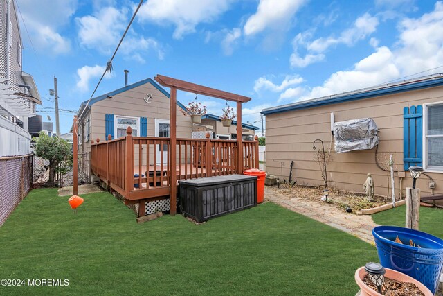 228 Hancock Ave, Seaside Heights, NJ 08751 - rear view of house featuring a wooden deck