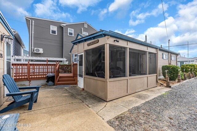 228 Hancock Ave, Seaside Heights, NJ 08751 - back of property with a sunroom and a deck