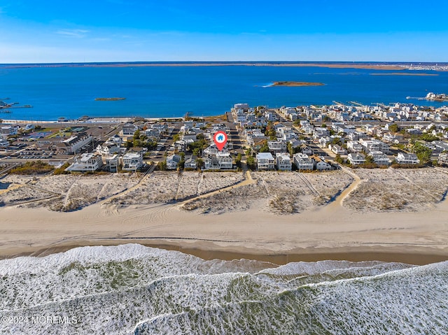 aerial view featuring a water view and a view of the beach