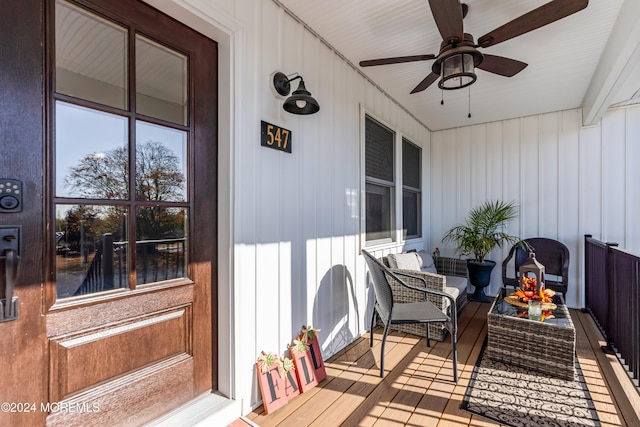 exterior space with ceiling fan