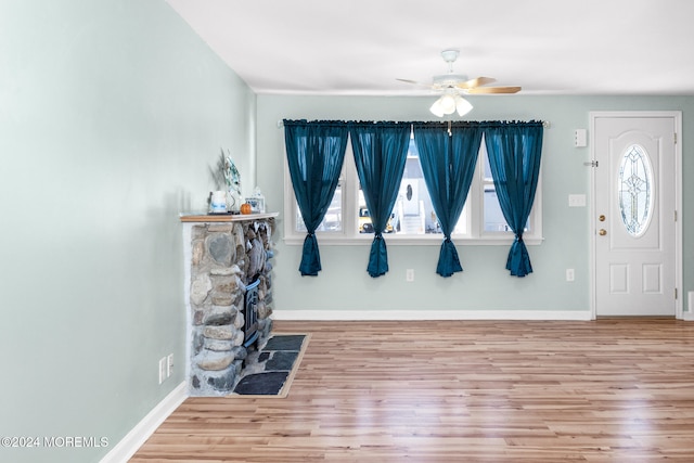 foyer entrance featuring ceiling fan, plenty of natural light, and hardwood / wood-style flooring