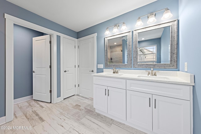 bathroom featuring vanity and wood-type flooring