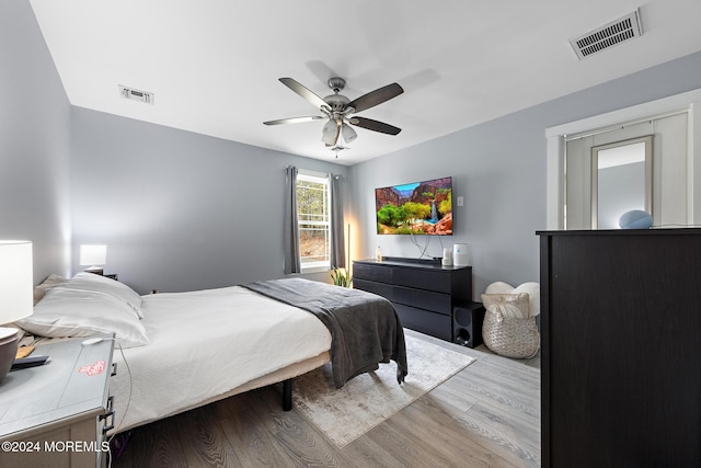 bedroom featuring ceiling fan and light hardwood / wood-style floors