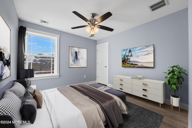 bedroom featuring ceiling fan and dark hardwood / wood-style flooring