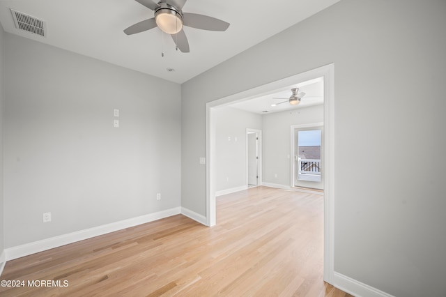 empty room with light wood-type flooring and ceiling fan