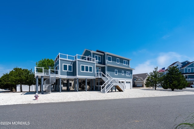 view of front facade with a balcony and a garage