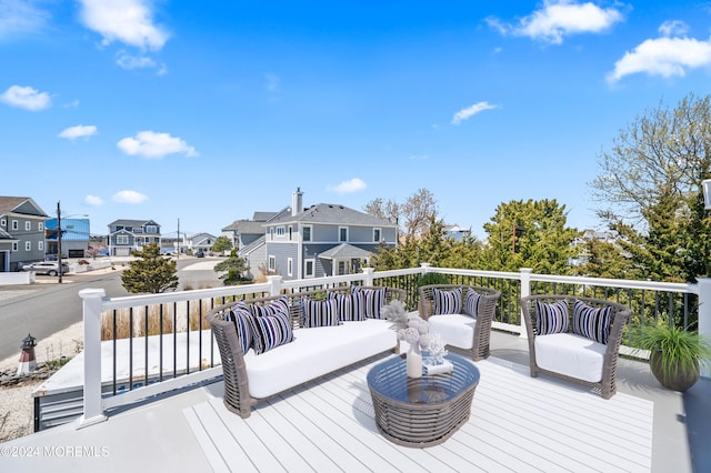 wooden terrace featuring an outdoor hangout area