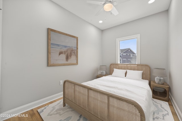 bedroom featuring hardwood / wood-style flooring and ceiling fan