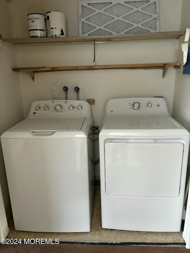 washroom with washing machine and dryer