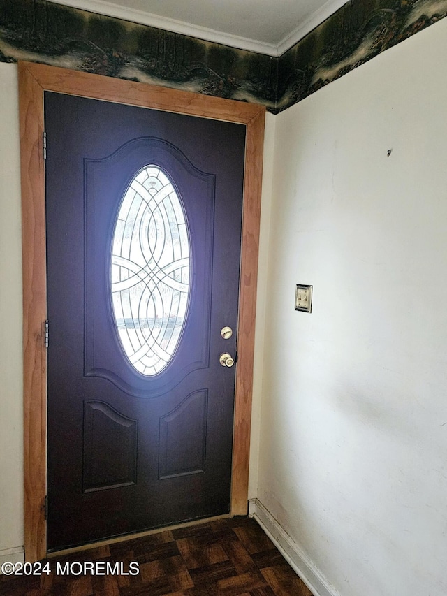 entryway with dark parquet flooring