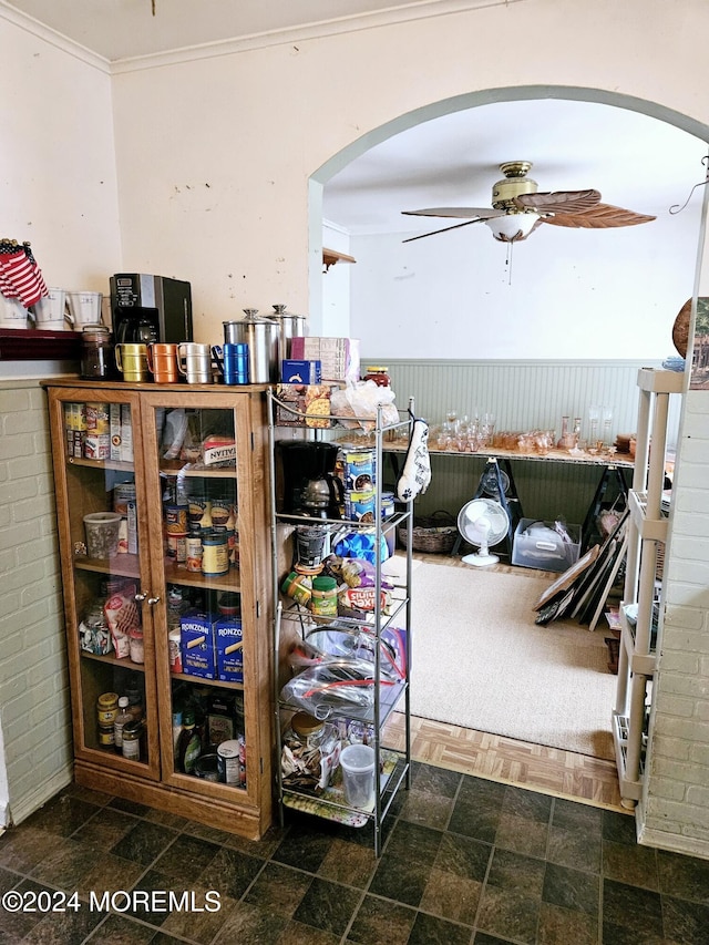 miscellaneous room with ceiling fan and crown molding