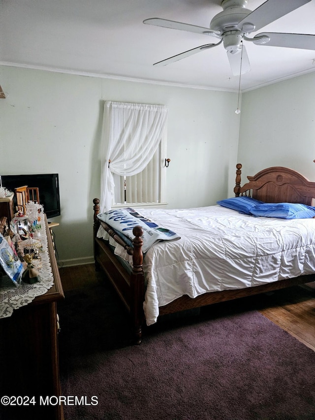 bedroom with ceiling fan, hardwood / wood-style floors, and ornamental molding