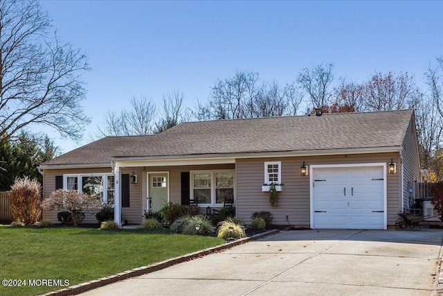 single story home featuring central AC, a garage, and a front yard