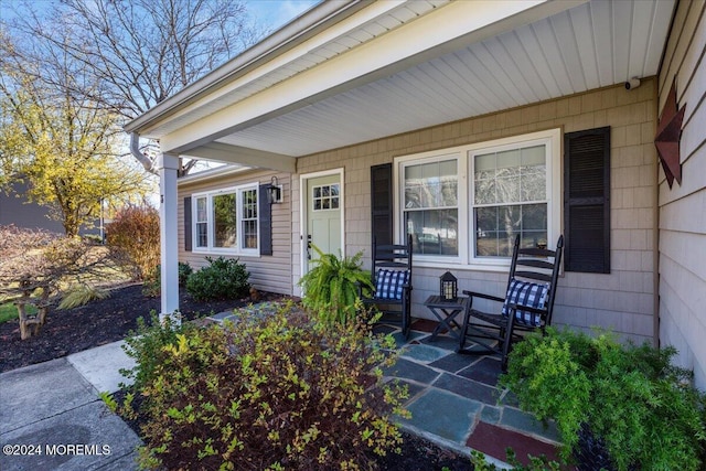 doorway to property with a porch