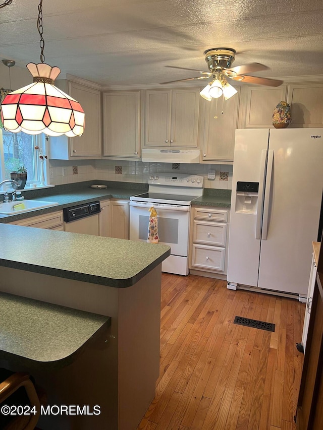 kitchen with ceiling fan, sink, pendant lighting, white appliances, and light wood-type flooring