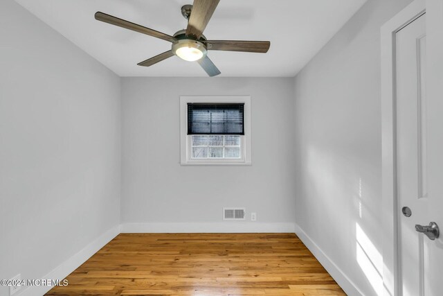 unfurnished room featuring ceiling fan and light hardwood / wood-style floors