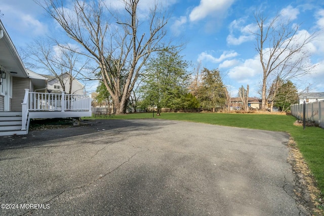 view of yard with a wooden deck