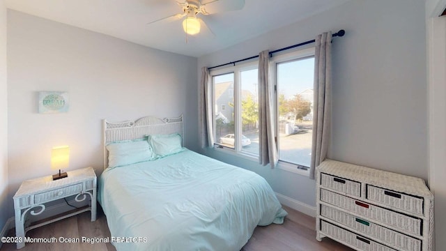 bedroom featuring ceiling fan and hardwood / wood-style floors