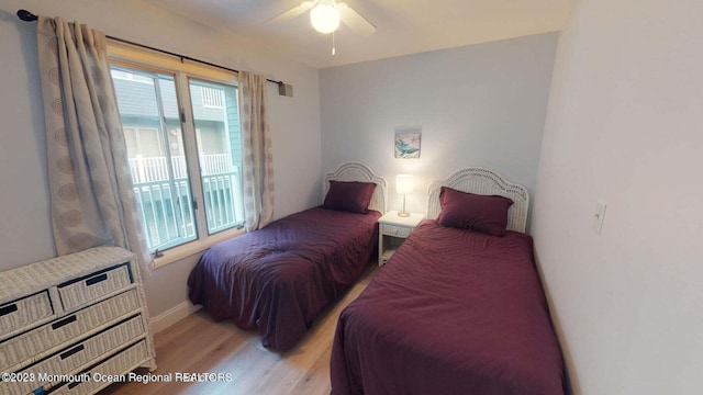 bedroom featuring light wood-type flooring and ceiling fan