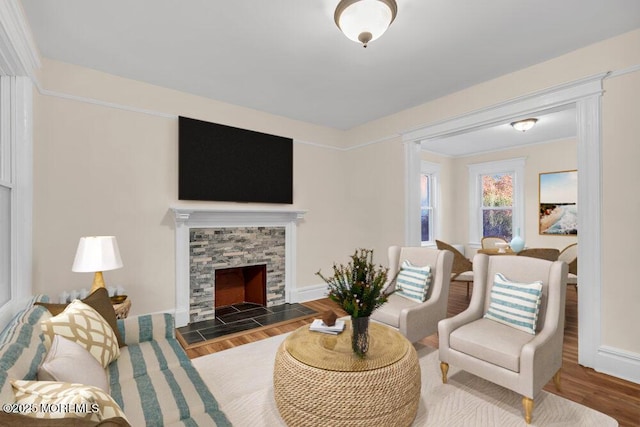 living room with a fireplace and dark hardwood / wood-style flooring