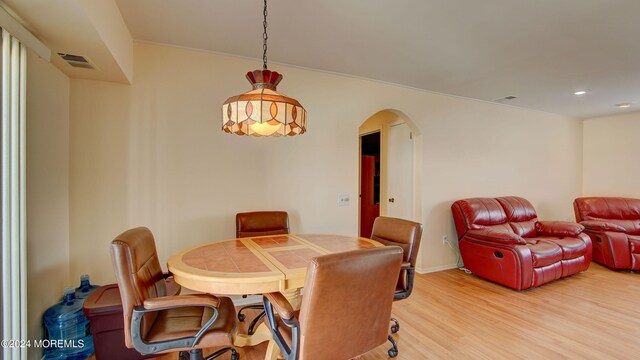 dining area with wood-type flooring