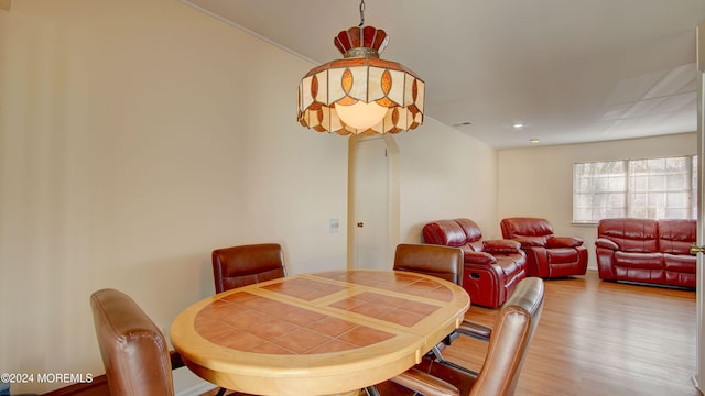 dining room with wood-type flooring