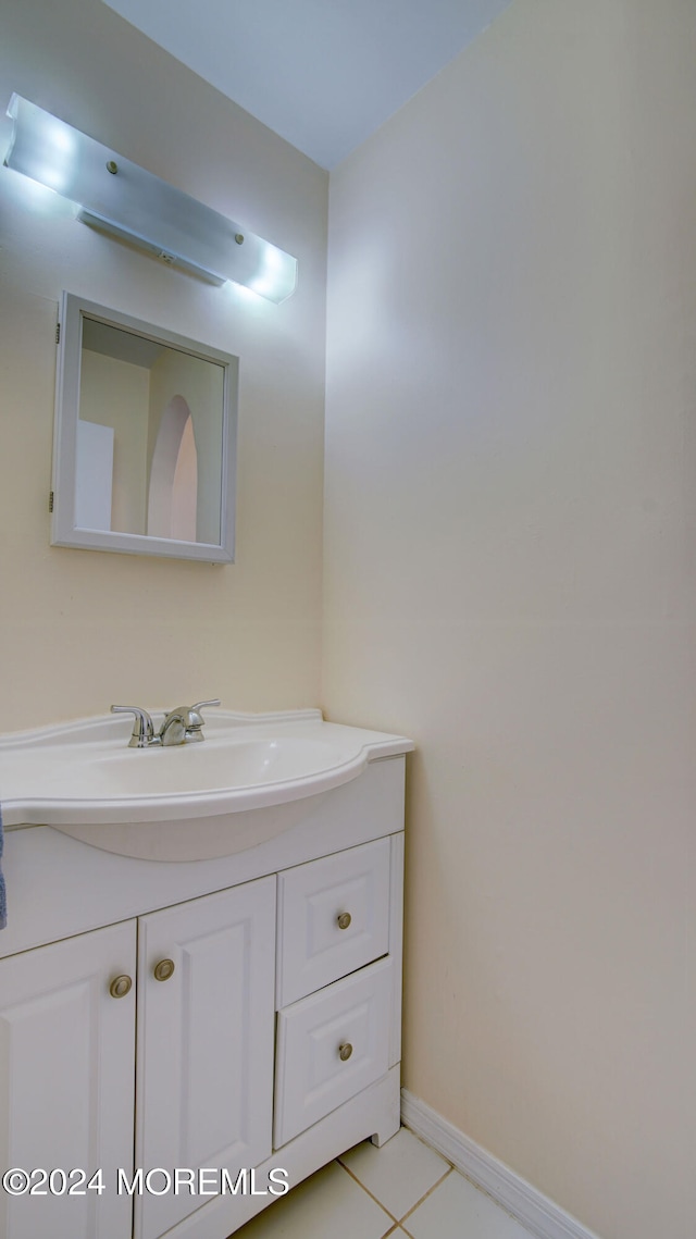 bathroom featuring tile patterned floors and vanity