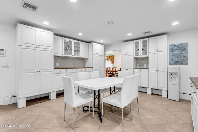 dining area featuring light tile patterned floors