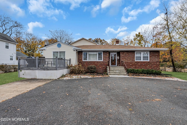 view of front of home with a wooden deck