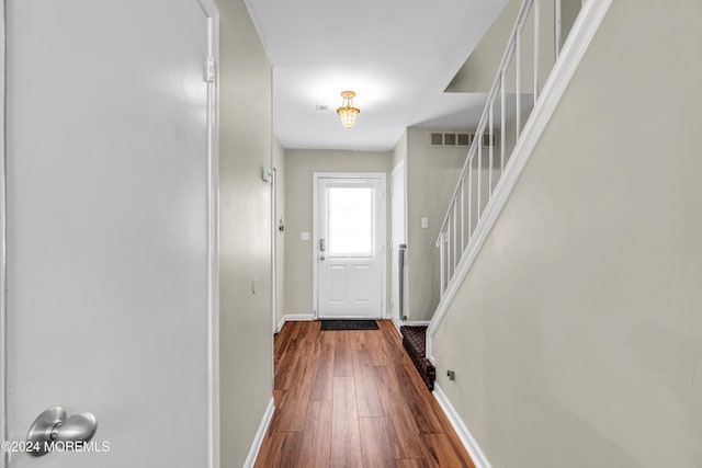 entryway with dark hardwood / wood-style floors