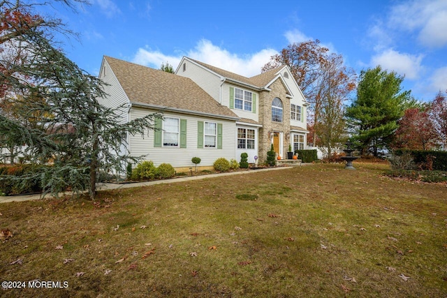 view of front facade featuring a front yard