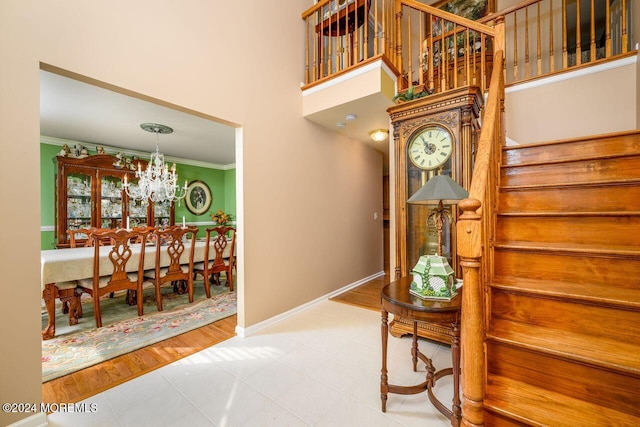 994 Hyson Rd, Jackson, NJ 08527 - stairs featuring crown molding, a chandelier, and tile patterned floors