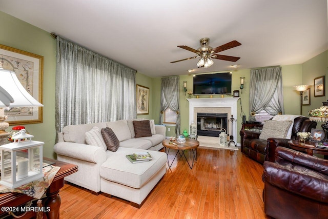 994 Hyson Rd, Jackson, NJ 08527 - living room featuring ceiling fan, a fireplace with raised hearth, wood finished floors, and plenty of natural light