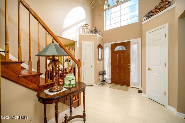 994 Hyson Rd, Jackson, NJ 08527 - entryway featuring a towering ceiling, stairs, and a chandelier