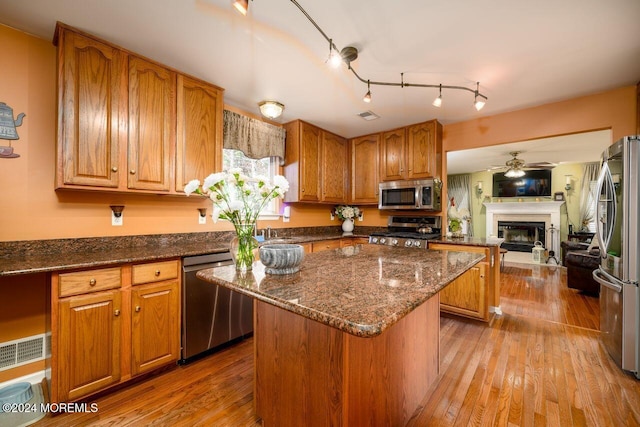 994 Hyson Rd, Jackson, NJ 08527 - kitchen featuring stainless steel appliances, a kitchen island, a ceiling fan, and light wood finished floors