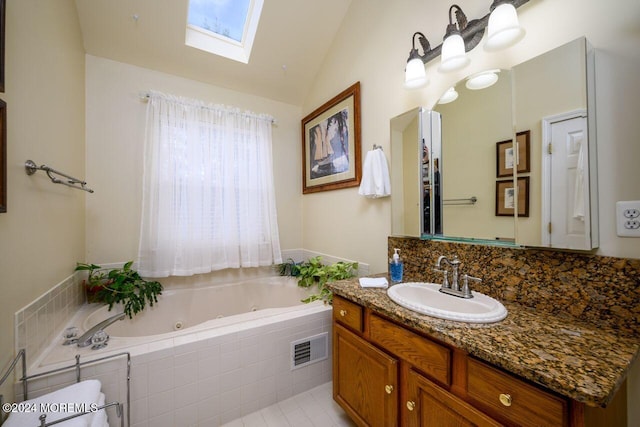 994 Hyson Rd, Jackson, NJ 08527 - bathroom featuring a skylight, vanity, a tub with jets, and lofted ceiling