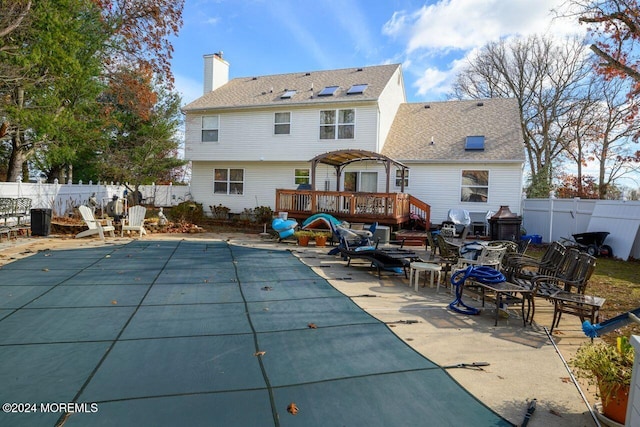 994 Hyson Rd, Jackson, NJ 08527 - back of house featuring a fenced backyard, a deck, a patio area, and a chimney
