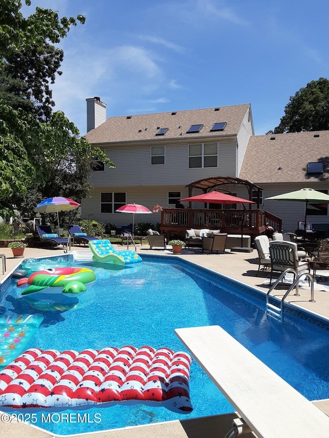 994 Hyson Rd, Jackson, NJ 08527 - swimming pool featuring a deck, a patio area, an outdoor living space, and a diving board
