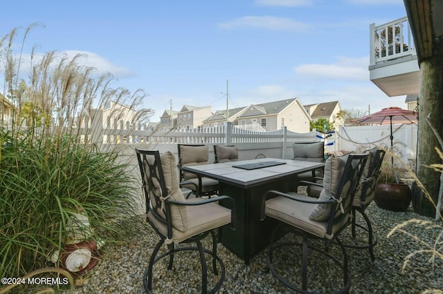 view of patio featuring a balcony