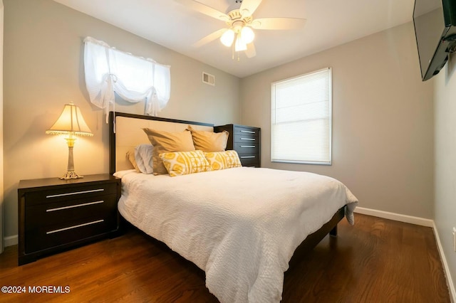 bedroom featuring dark hardwood / wood-style flooring and ceiling fan