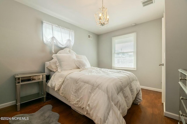 bedroom with dark wood-type flooring