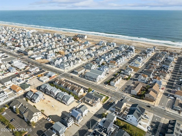 bird's eye view with a view of the beach and a water view