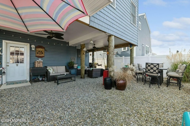 view of patio with ceiling fan and an outdoor hangout area